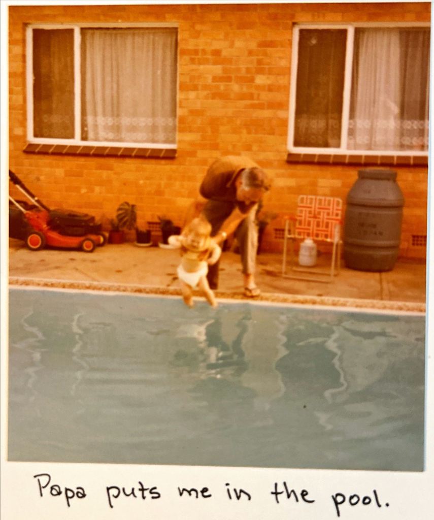 the author's Papa dips his feet in the pool.  