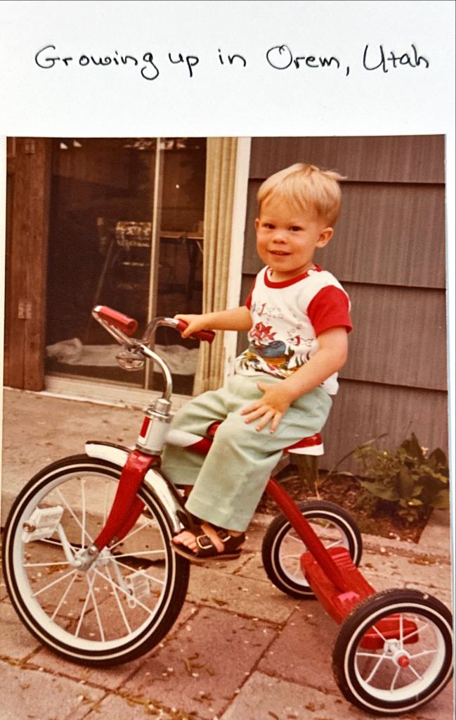 the author rides a tricycle in Orem, Utah