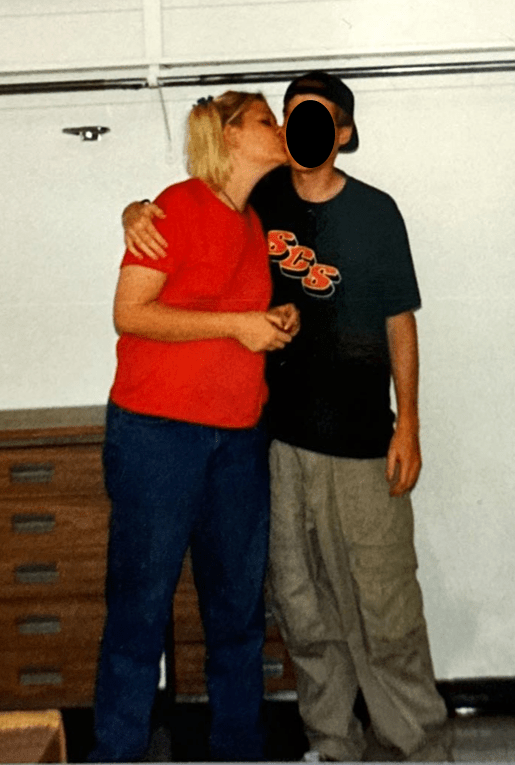 Courtney* kissing her college boyfriend and long-term lover.  This is around 1995.  I censored his face.  Courtney has her classic blonde hair done up in pigtails... 90's rebel girl