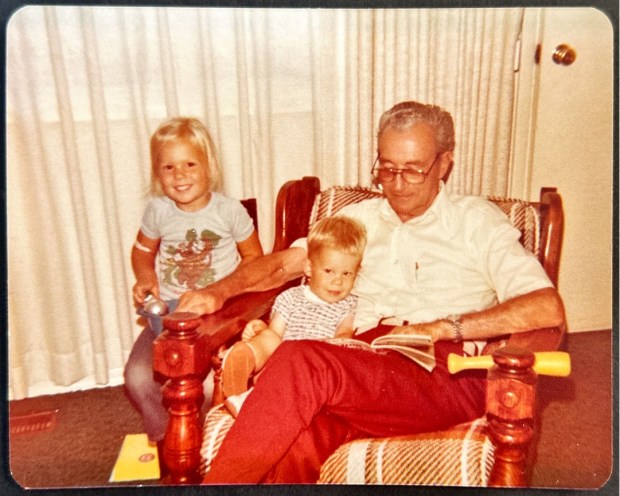 Courtney sits next to Joseph and Grandpa in Copper, Arizona in 1980