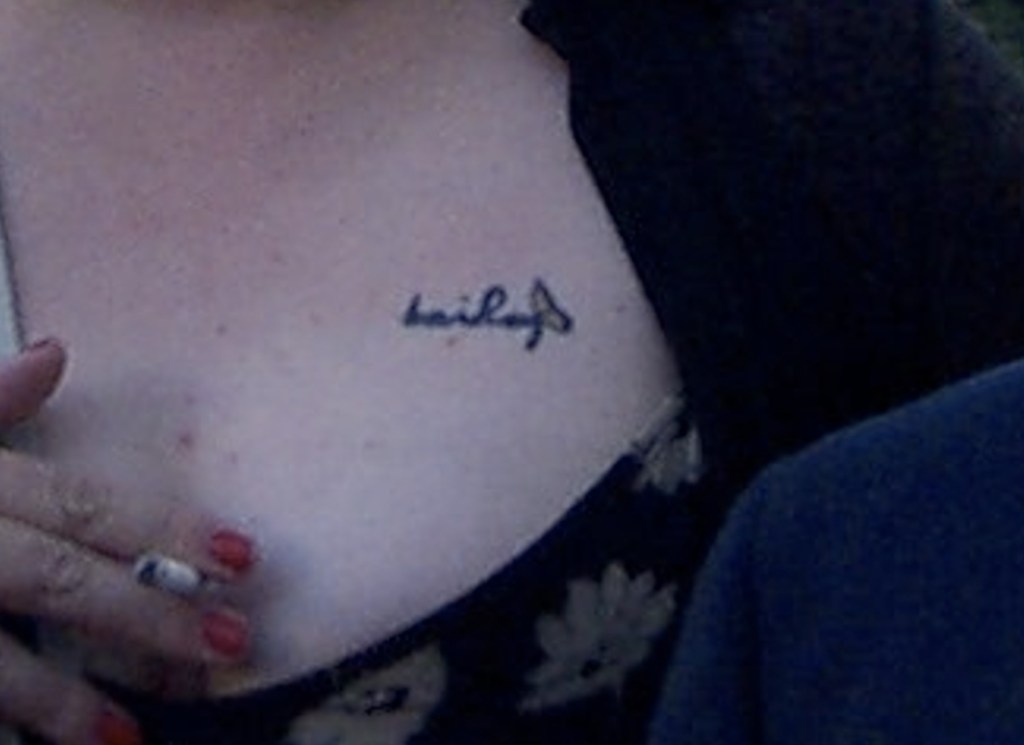 a picture of Courtney's tattoo showing her dead daughter's name with a butterfly added to the "y" of bailey.  