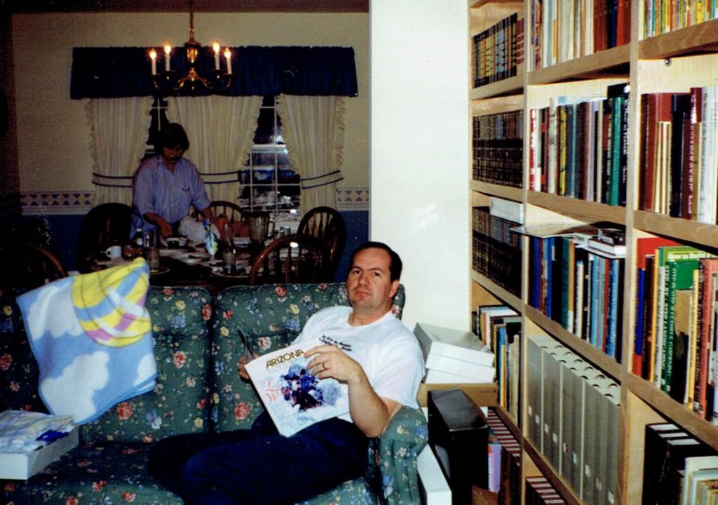 a 1992ish photo of Kurdt's parents cleaning up after Christmas morning.  Mother is womanly cleaning up the dining room while Father is manly sitting on the couch with an Arizona Highways magazine.  he is looking at the cameraman with curious disdain. 