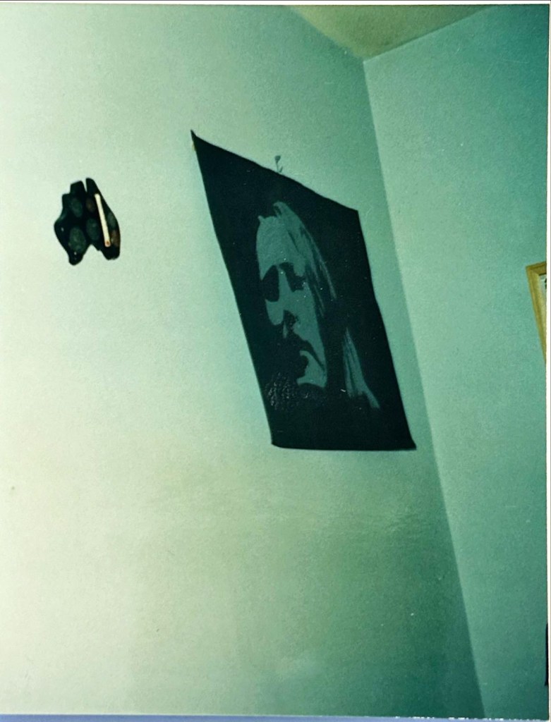 a photo of Joseph's* teenage shared bedroom.  There is an Australian thermometer and a charcoal drawing that Joseph made in art class.  That art was hanging up when I attempted #2.
