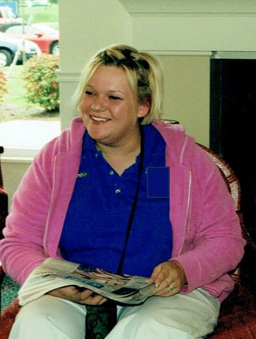 Courtney at a work event. she has a beautiful, real smile on her face.